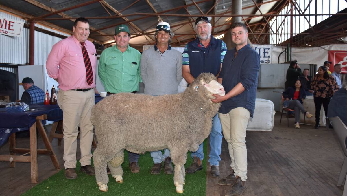 Elders stud stock manager Tim Spicer (left), Nutrien Livestock Breeding representative Mitchell Crosby with the $6000 second top price buyers Alan and Phil Bear, Moonijin stud, Dowerin and joint Nepowie stud master Blake White holding the Bear's ram.