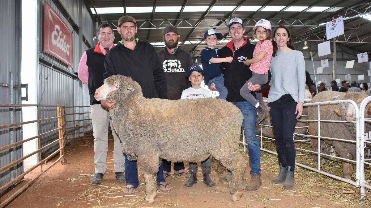 The top price in the Poll Merino offering was $5000 for this sire paid by the Sudholz family, S & M Sudholz, Piawanning. With the ram were Elders stud stock manager Tim Spicer (left), buyers Michael and David Sudholz and Kolindale co-principals Luke Ledwith and Daniela Varone with their nephew Harry Hunter, son Louis and niece Lucy Hunter.