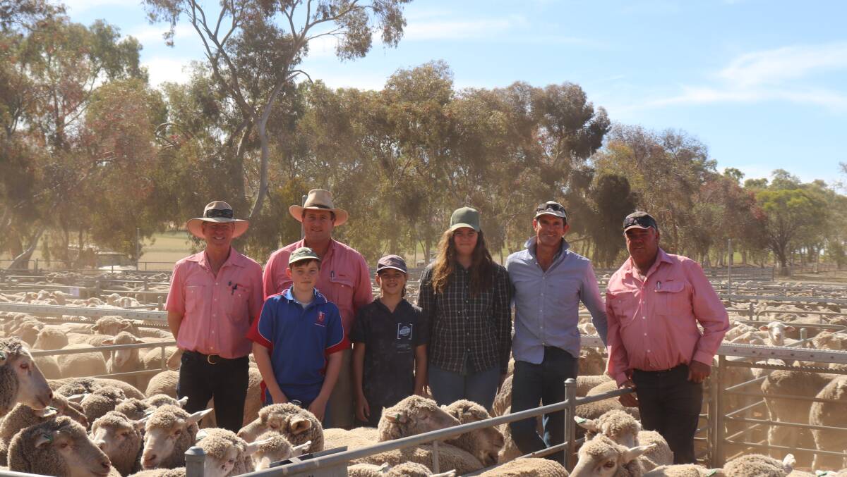  The $242 second top-priced line of 404 July shorn, Wallinar-MPM blood 1.5yo ewes was offered by Hansworth Valley Holdings and sold to AW & DJ Mcclelland. Jeff Brown (left),Elders Wickepin, Paul Kepel, Elders Narrogin, William Reid, Adyn Reid, Vendors Sophie and Greg Mycock, Kukerin and Elders agent Lake Grace Graeme Taylor at Wickepin.