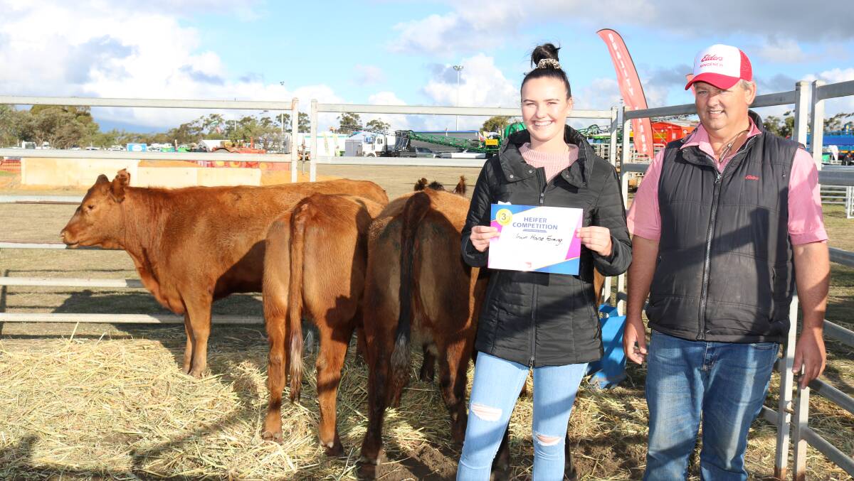 Brooke O'Brien, Irwin, was happy to collect third prize on behalf of her family's Irwin House Farming for Angus-Shorthorn heifers watched by Elders Mingenew livestock agent Ross Tyndale-Powell.
