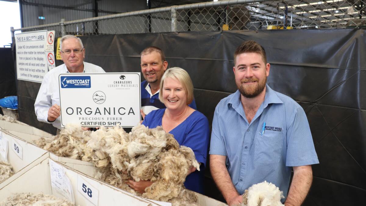 Russell Lockyer (left), son-in-law Gavin Penn and daughter Stephanie Penn, Treehaven, Bolgart, inspect their first certified Organica Precious Fibre wool clip on the Westcoast Wools & Livestock show floor with Organica specialist Justin Haydock.