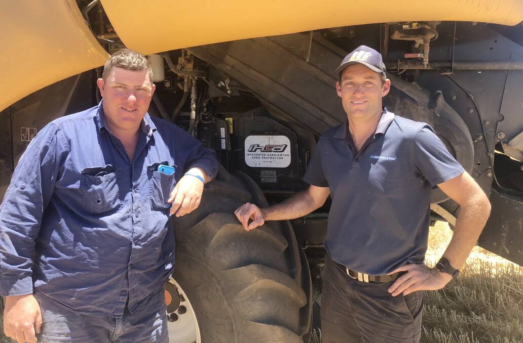 Western Australian grower Warren Treasure (left), Moonyoonooka, with Craig Harrington, McIntosh & Son, Geraldton, says with the new vertical, mechanical Integrated Harrington Seed Destructor, the family has the ideal system to help limit weed seed numbers.