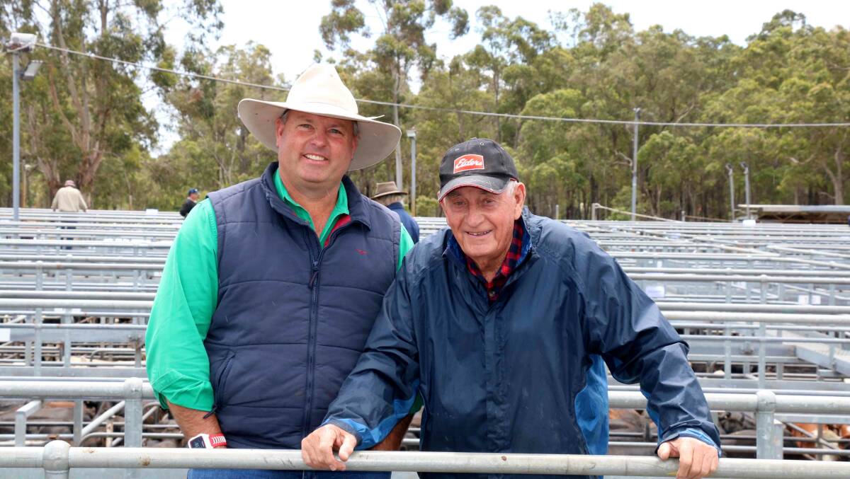  Auctioneer Chris Waddingham (left) with long-term client, Kevin Lewis, Brunswick, at the Boyanup sale. Kevin bought a couple of pens during the sale.