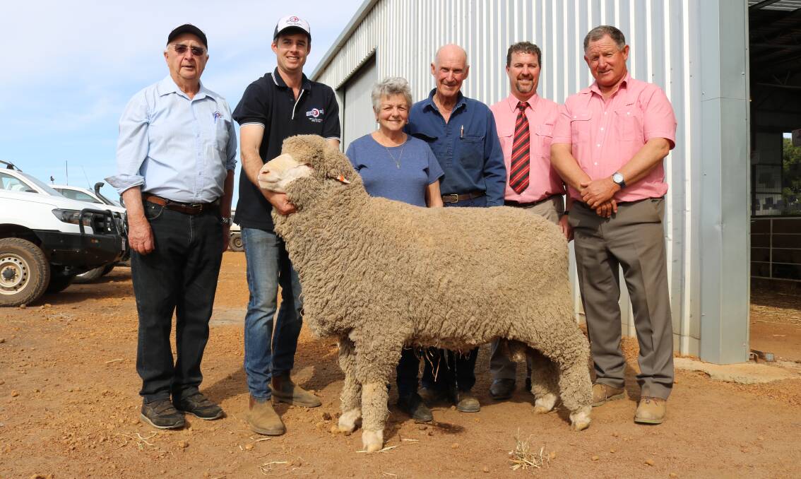 With the $7200 top-priced Poll Merino and second top-priced ram of the day were former Kolindale principal Colin Lewis (left), Kolindale stud co-principal Luke Ledwith, buyers Willa and Richard Steel, South Yilgarn, Elders auctioneer Nathan King and Elders stud stock representative Russell McKay.