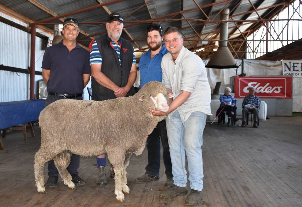 Top price buyers Alan (left) and Phil Bear, Moonijin stud, Dowerin and Dylan and Blake White, Nepowie stud, holding the $7000 top-priced ram at the Nepowie on-property sale at Nomans Lake.
