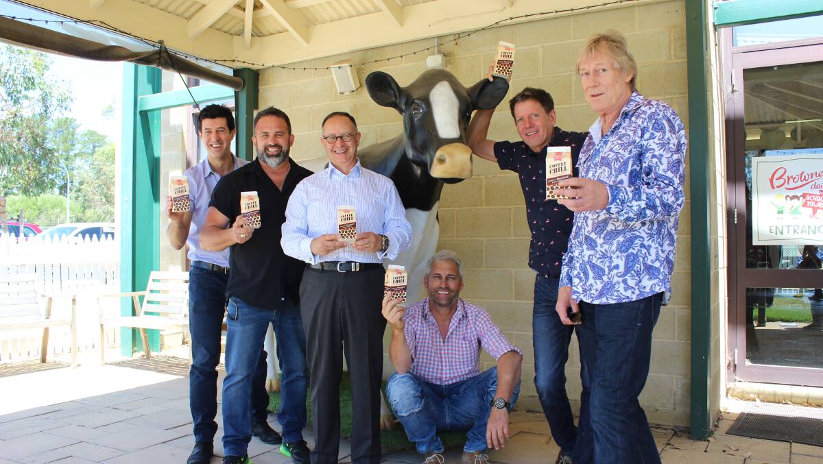 Brownes Dairy managing director Tony Girgis (third from left) with some of the people from the original 2000 television advertisement for Percolated Coffee CHILL flavoured milk featuring baristas filling CHILL cartons. From left they are actors Michael Caruso, David Carbone and Dean Harnett (seated), music composer Tim Count and voice-over man Gary Taylor. 