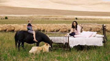 Iris and Wool founder Emily Riggs with her two children Sam (4) and Lucy (nearly 2) on the Riggs familys South Australian property near Burra, where they run a flock of 15,000 Merino sheep.