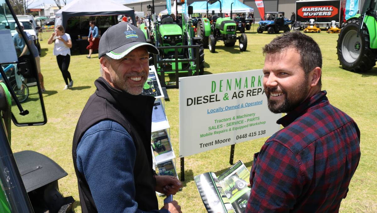 Denmark Diesel & Ag Repairs principal Trent Moore (left), Denmark, used the Deutz catalogue in conjunction with tractor models on display to help client Andrew Lee finalise his choice of tractor to purchase.