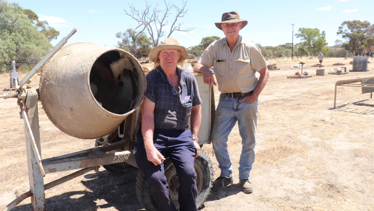 Les Morton (left), Northam and John Springbett, York, with a cement mixer powered by a vintage single cylinder Moffat-Virtue hand-cranked petrol engine that later sold for $30.
