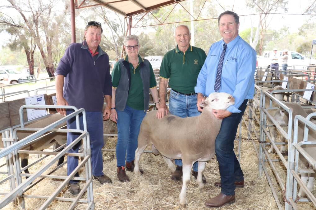 Geoff Hosking (left) buying for Roemarie Enterprises, Cordering, was the volume buyer of the sale with 12 rams five Suffolks and seven White Suffolks. He is pictured with parents and Paringa Park principals Jenny and Nick Hosking and Westcoast Wool & Livestock auctioneer Steve Harris holding one of the Paringa Park White Suffolk rams Mr Hosking purchased.