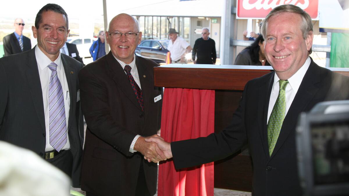 Former State Agriculture Minister Terry Redman (left), with the Western Australian Meat Industry Authority chairman Kerry McAuliffe and premier Colin Barnett celebrate at the opening of the Muchea Livestock Centre in May 2010.