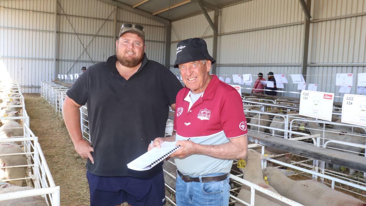 Shaun (left) and Rod Simpson, Barby Downs White Suffolk stud, Quairading, made notes on their catalogue favourites before the sale. The Simpsons purchased 15 White Suffolk ewes to a top of $1650 and an average of $867.