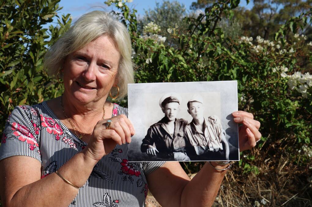 Barbara Mottershaw at home at Bolgart with the photograph of her PoW father and a Japanese boy who befriended him that has become the subject of a Japanese television documentary.