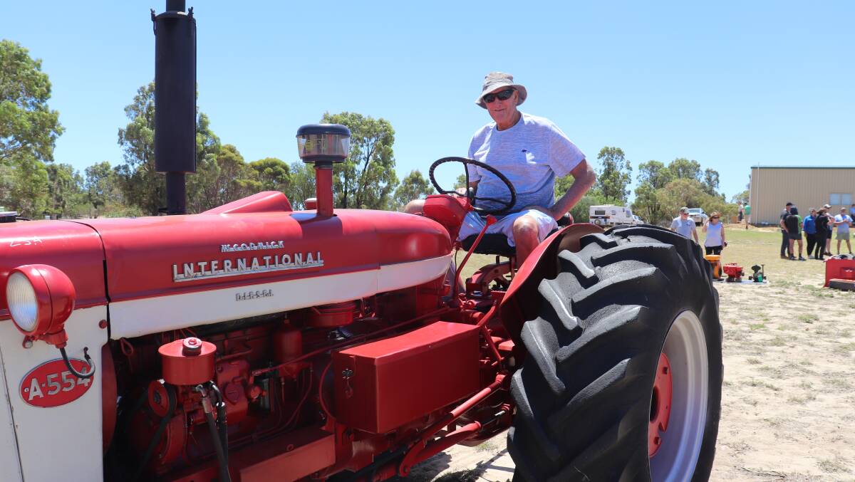 Former Dandaragan farmer Rick Evans, Cervantes, reminiscing on his early farming years while checking out the McCormick International A554 at the Jurien Bay Nutrien Ag Solutions clearing sale last week for Arthur Hogg. Mr Evans said 52 years ago he drove a similar model on the farm for his father. "There was no cab in those days, you just wore a greatcoat," he said. "When cabs came along it was a luxury, but it kept the weather out." The model he drove then had no power steering and the seat wasn't as comfortable. The tractor sold for $4750 during the sale.