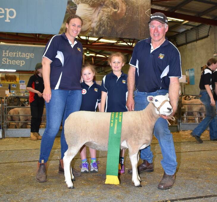  With the reserve grand champion meat breeds ewe, exhibited by the JimJan Texel stud, Boyup Brook, were Kristy Roberston (left) and her father and JimJan con-principal Jim Glover. With them were Kristy's daughters Josie and Ella.