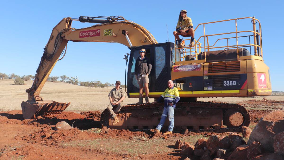  Slowly getting rid of rock ridges has been part of the Popplewell's program for eight years. Mr Bawden (left) and Mr Popplewell brought on contractors Kenneth Bavage and Jake Fewster to get the job done.