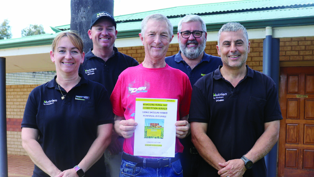 Hay competition category two winner Neil Bruce (centre), Waroona, with Barenbrug WA territory manager Tim O'Dea (back right) and Naomi and Dominic Pinzone (front) and Michael Needs, all from Waroona Rural Services.