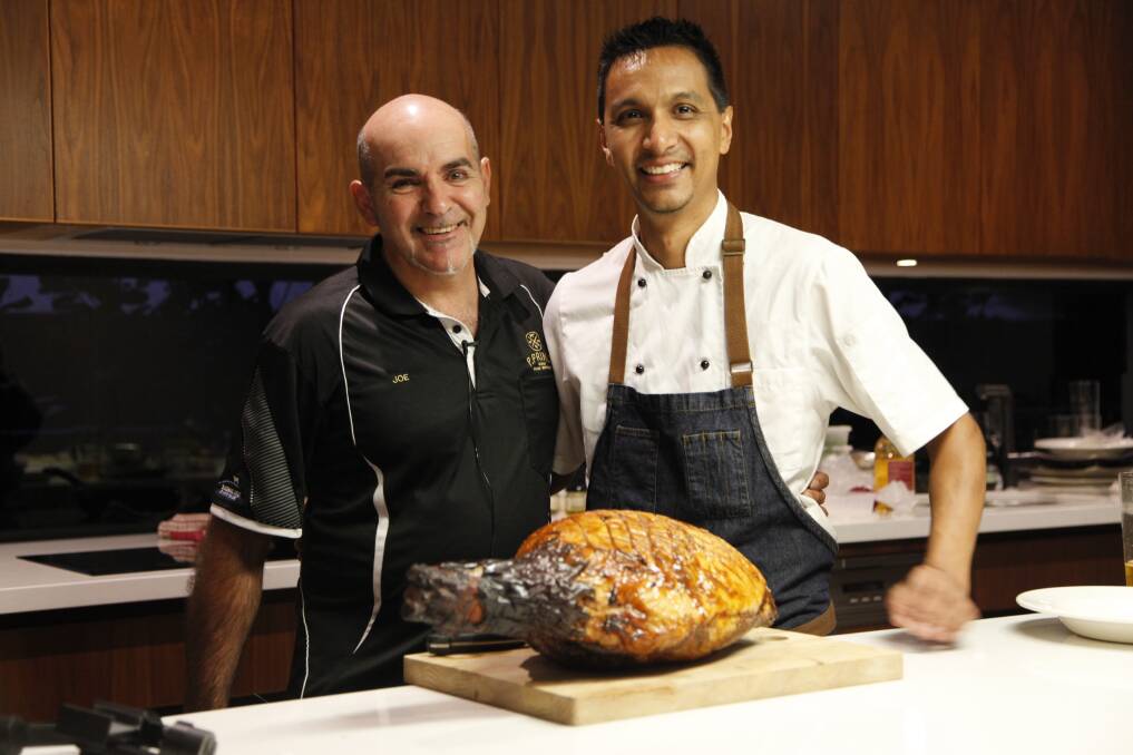 Joe Princi and Janel Diaz, store manager from P. Princi Butchers, celebrate the win in the annual ham competition.