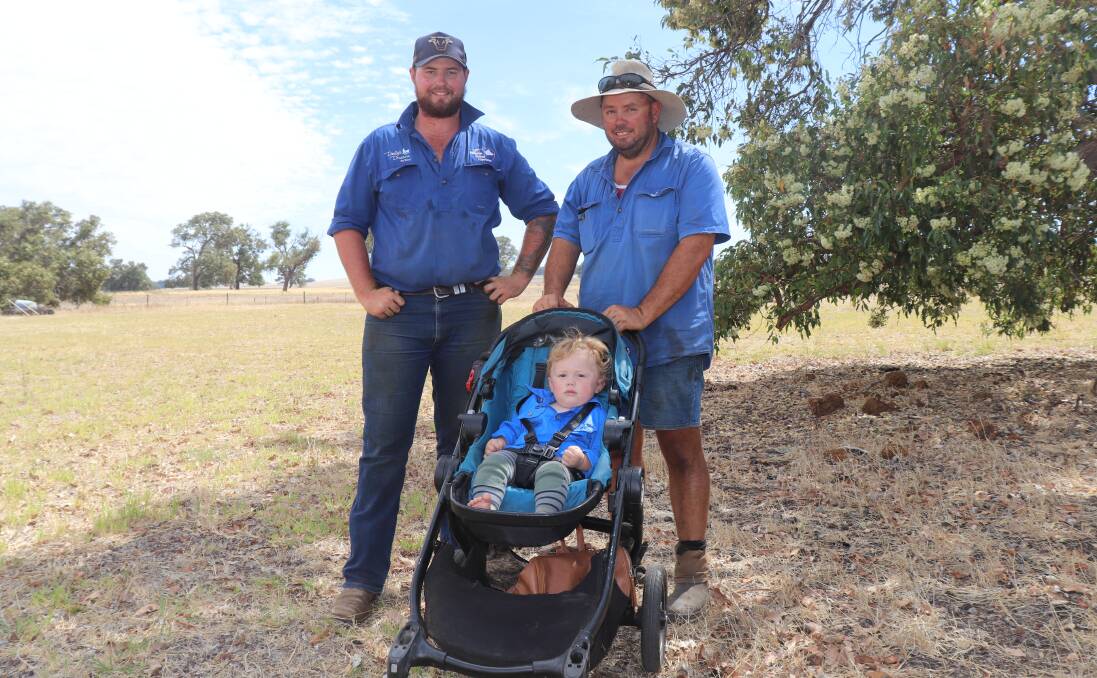 Josh Freeman (left) and Brad Alp, both of Beermullen, with William Alp who has just turned one and is already attending his second clearing sale.