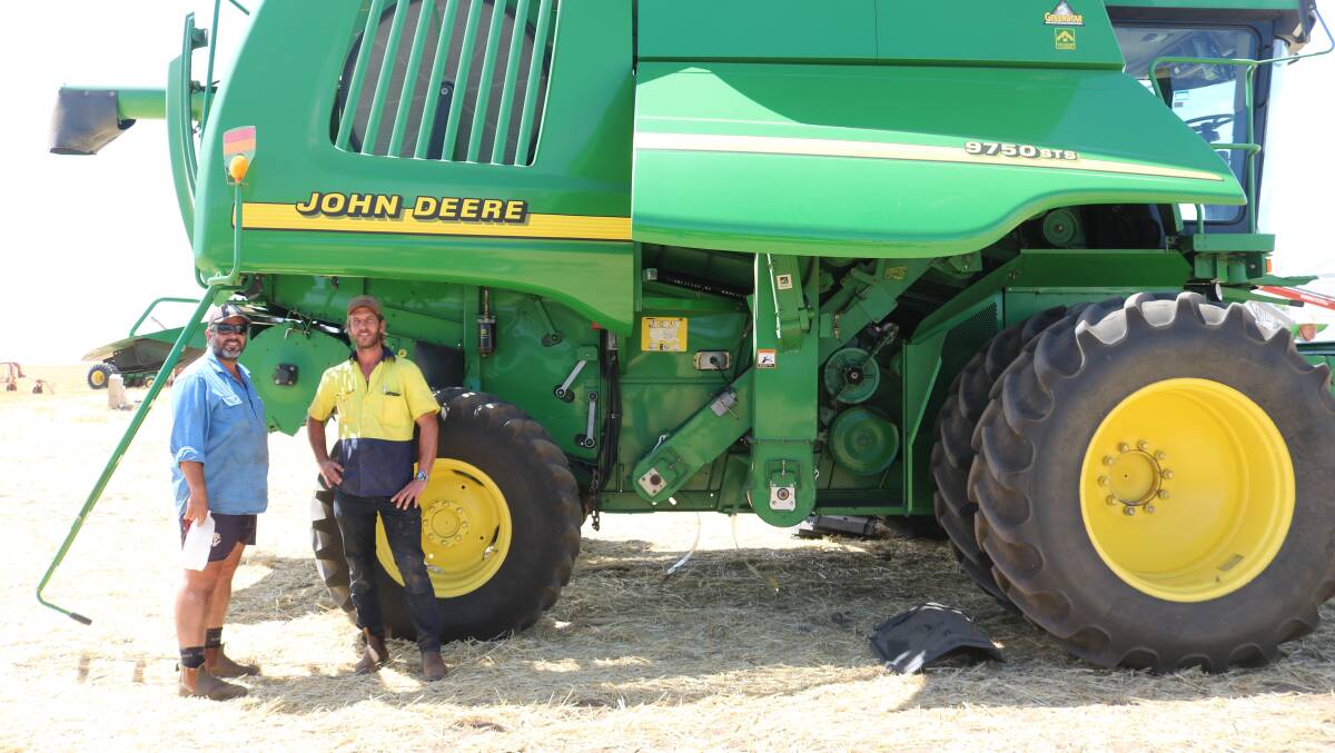 Cameron and Jayden Smith, Northam, inspect the 2001 John Deere 9750 STS header, which sold for $75,000.
