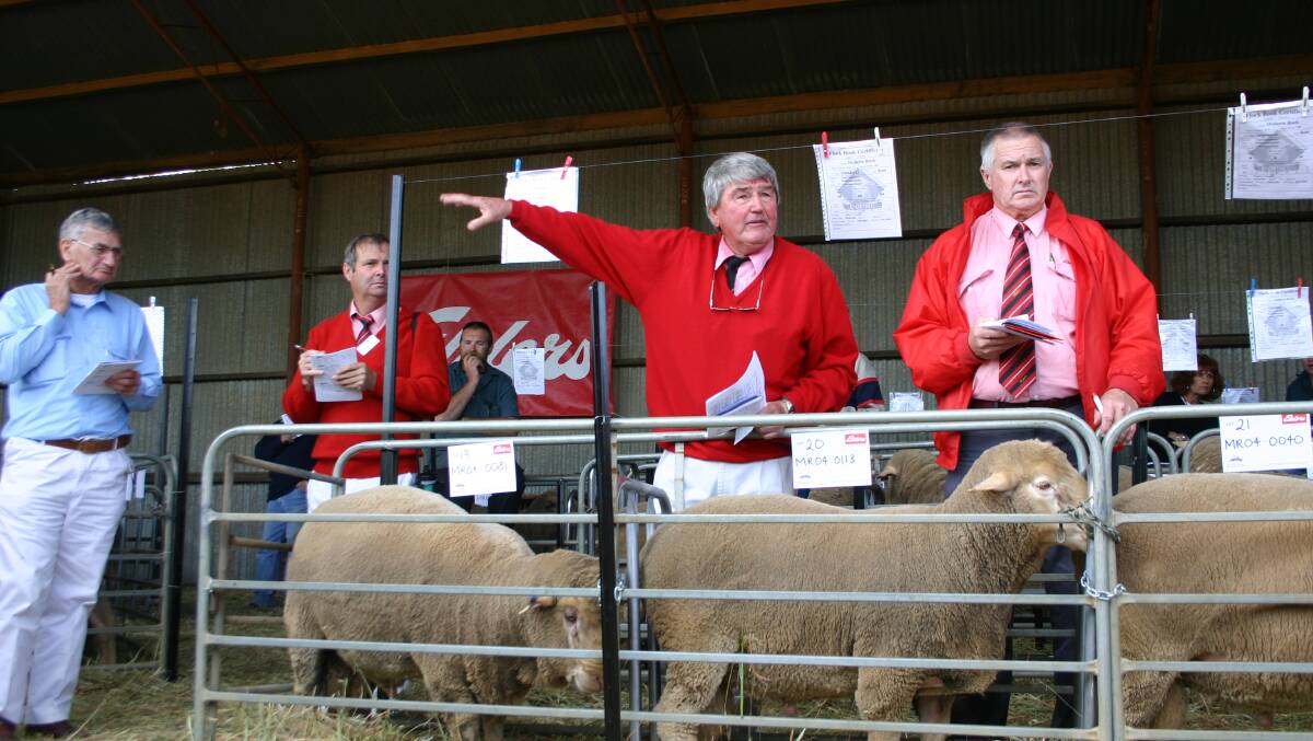 Mr Gamble (centre), auctioneering at one of the Longmuir family's annual Mollerin Rock Dohne on-property ram sales, Koorda.