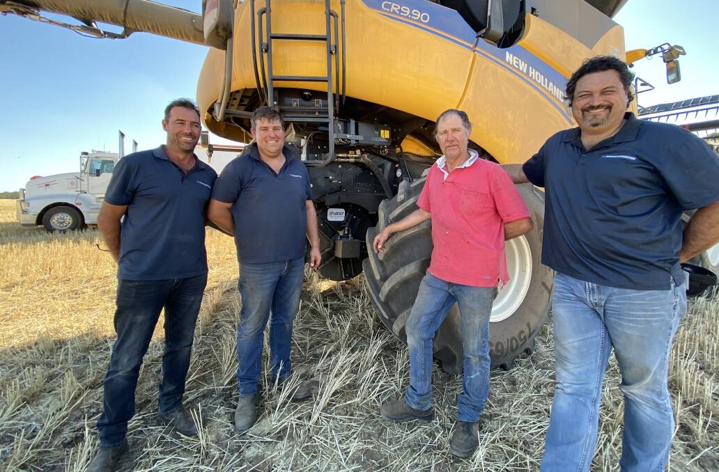  Richard Davies (second from right), who farms in the Coorow and Carnamah areas, with Johnny Inferrera (left) and Max Herbert (far right), McIntosh Distribution and Matt Howard, McIntosh & Son Moora, during an inspection of a vertical Integrated Harrington Seed Destructor (iHSD) fitted to the Davies' new harvester, a New Holland CR 9.90.