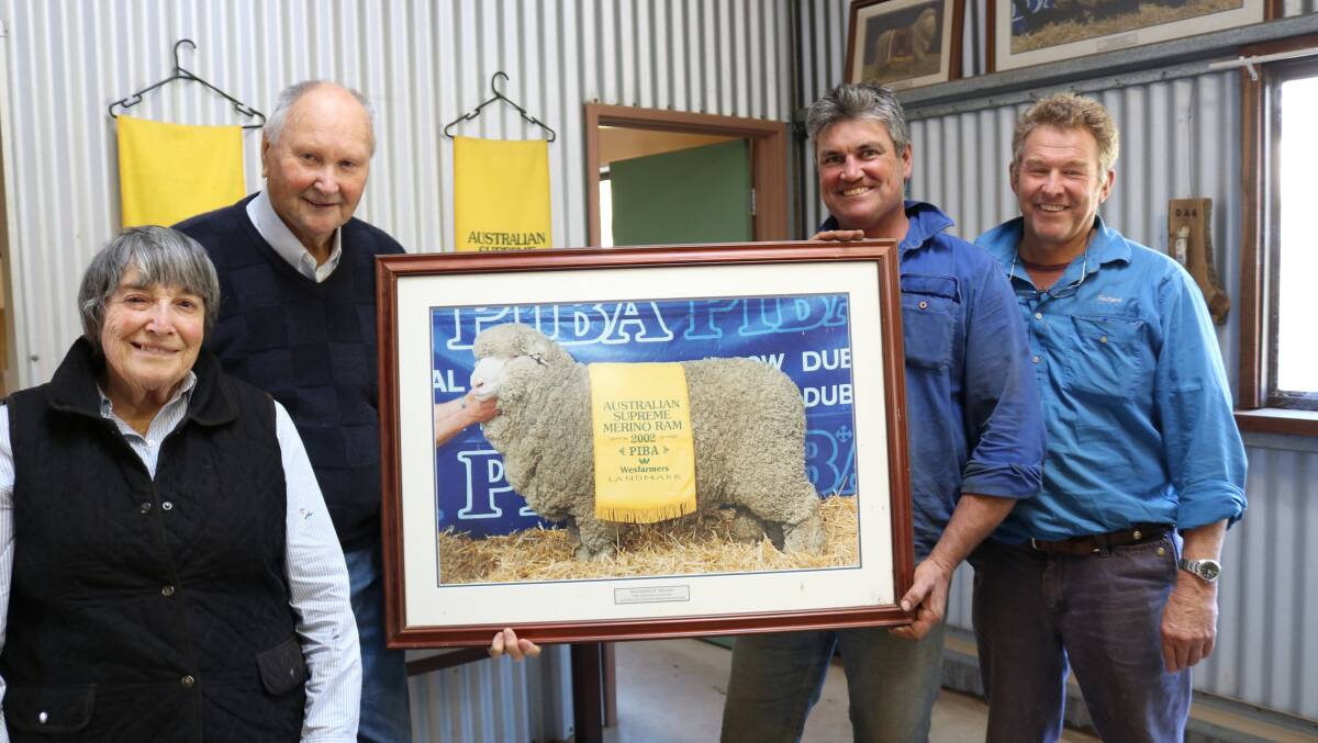 Willemenup principals Barb, Dick and Collyn Garnett and Barloo co-principal Richard House with the photo of Willemenup Sir Winston, the Australian Supreme Merino Ram at Dubbo in 2002.