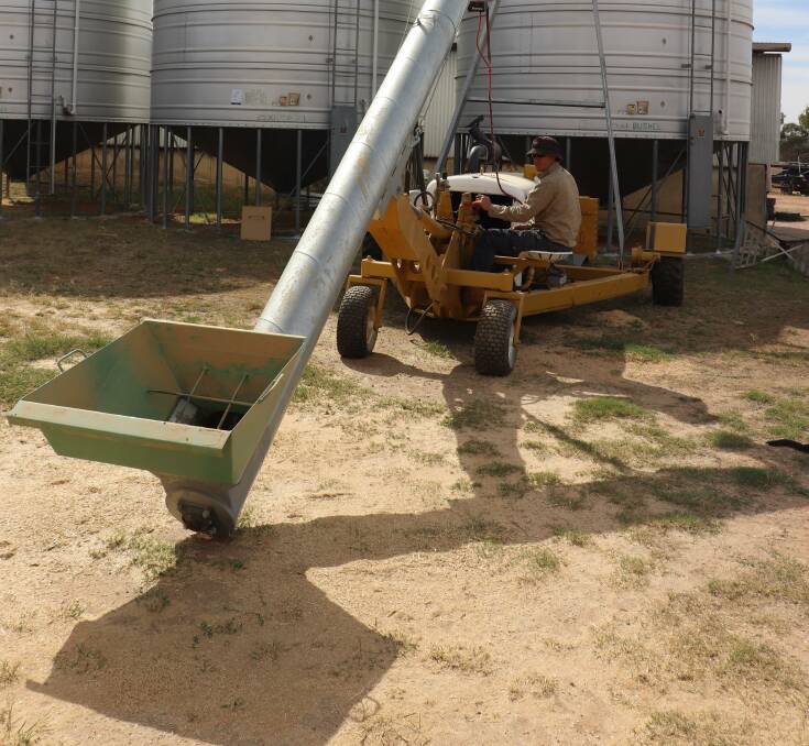  John Seabrook operating the augers adjustable barrel. 