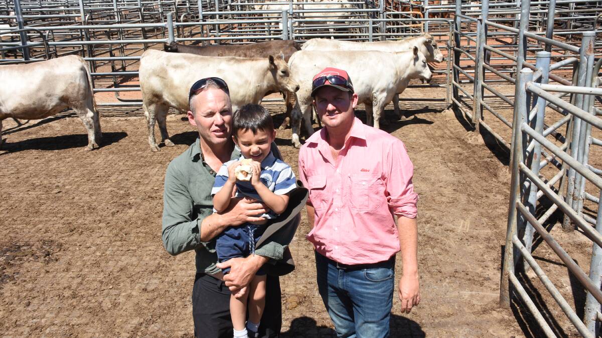 With the $2300 top-priced pen of Murray Grey heifers sold by the Bagshaw family, Young Guns Murray Grey stud, Hyden, were vendor Lindsay Bagshaw (left), holding son Seth and Elders, Boyanup representative Alex Roberts.