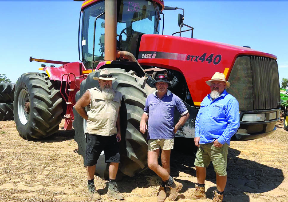 Matt Whitfield (left), Ajana, Dave Seeber, Northampton and Murray Royce, Binnu with the Case STX440 Steiger tractor that was the top-priced lot at $91,000.