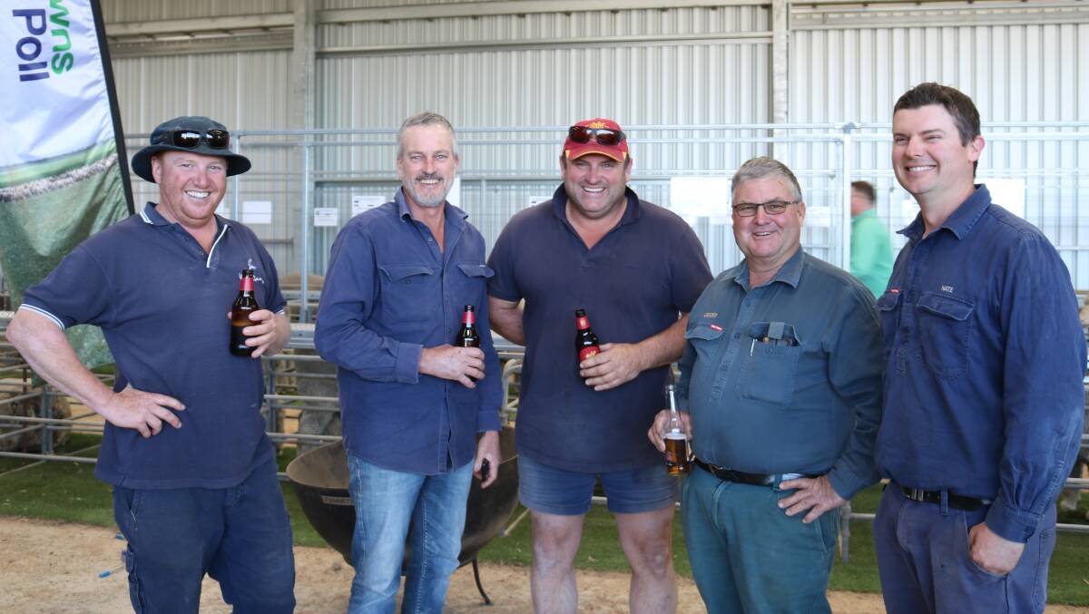  Enjoying a well-earned refreshment after the sale were buyers Rocket Roberts (left), Milarup Grazing, Lake King, who finished with nine Merinos, Rick Twigg and Robbie Crapella, Tandara Traders, Boyup Brook, 11 Poll Merinos and Geoff Sanderson and his son Nate, Grass Patch, who bought three Merinos.