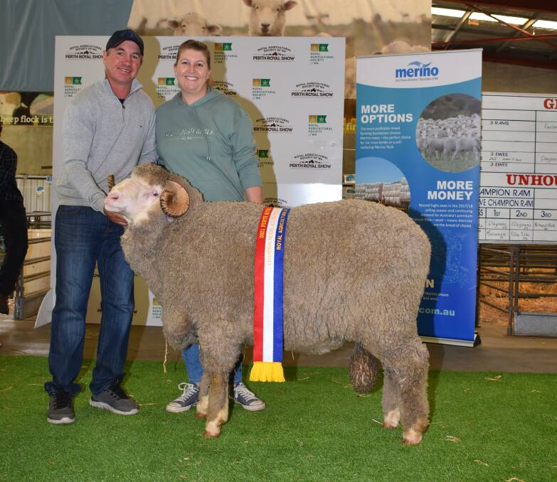  With the champion autumn shorn Merino ram under 1.5 years exhibited by the Mullan family's Eastville Park stud, Wickepin, were Grantly and Elise Mullan.