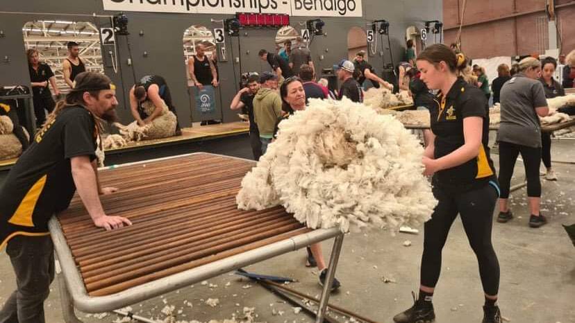 Ms Crossen (right) practising for the National Wool Handling and Shearing competition in Bendigo in November last year.