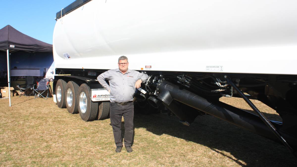 Duraquip director Rodney Richardson next to the company's popular Tornado belly dump trailer.