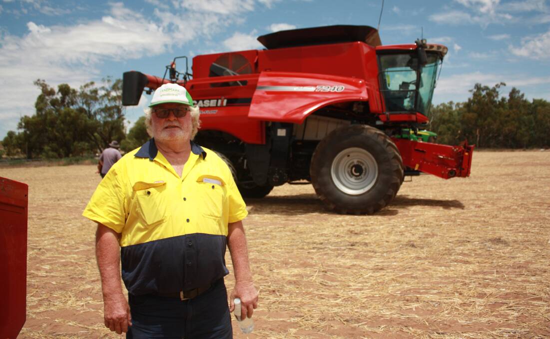 Robert Newton, Mingenew, finished an inspection of the lines in front of this Case IH 7240 combine harvester which was later passed-in on an opening bid of $340,000.