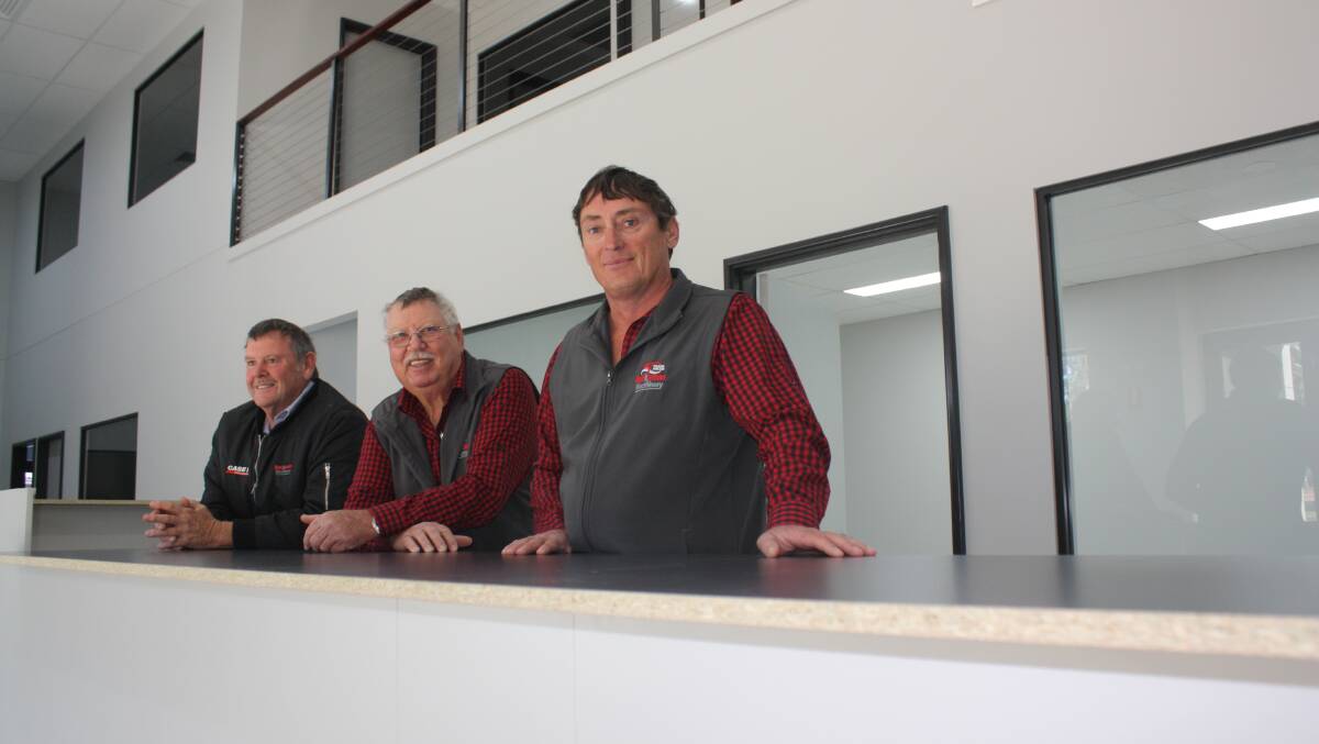 These Boekeman Machinery, Dowerin, staffers have 127 years of experience in the industry. From left, salesman Wayne Stoner, operational manager Colin Riggs and branch manager Peter Crippen. They were pictured last week as the finishing touches were being made to the branch's new office complex, replacing the original asbestos building erected in 1976. The rear workshop, built in the 1950s, has also been refurbished and expanded.