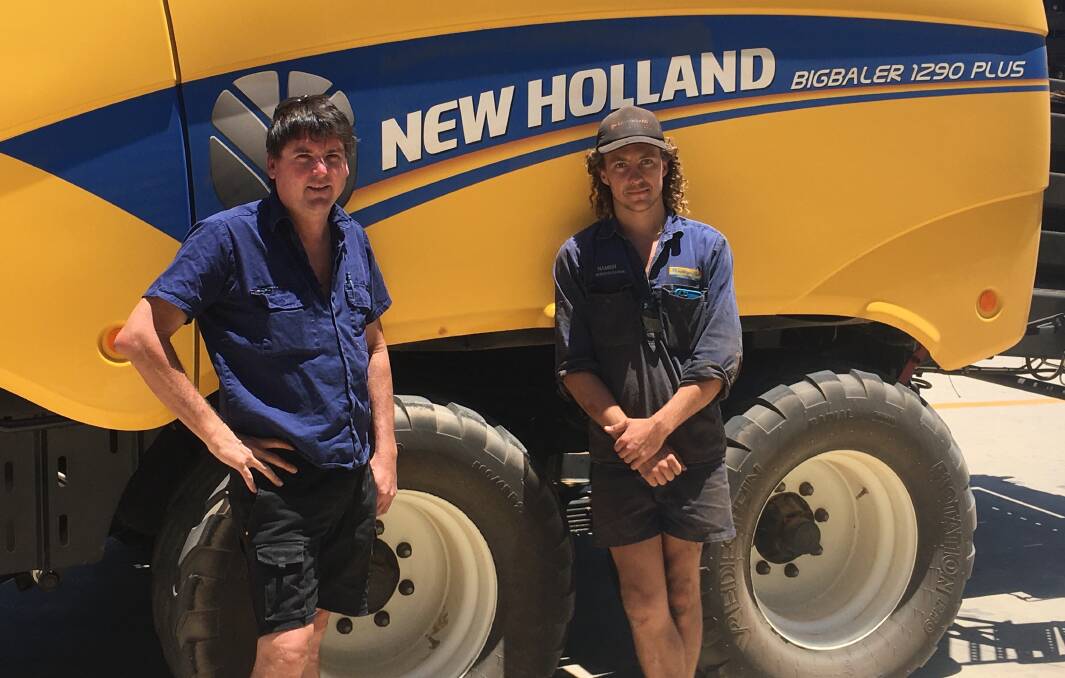 Geraldton area hay contractor Michael Patience (left), with Hamish Pulbrook, McIntosh & Son Geraldton, and his New Holland BigBaler 1290 PLUS. Michael said service and support was number one when it came to his decision on purchasing a new baler.