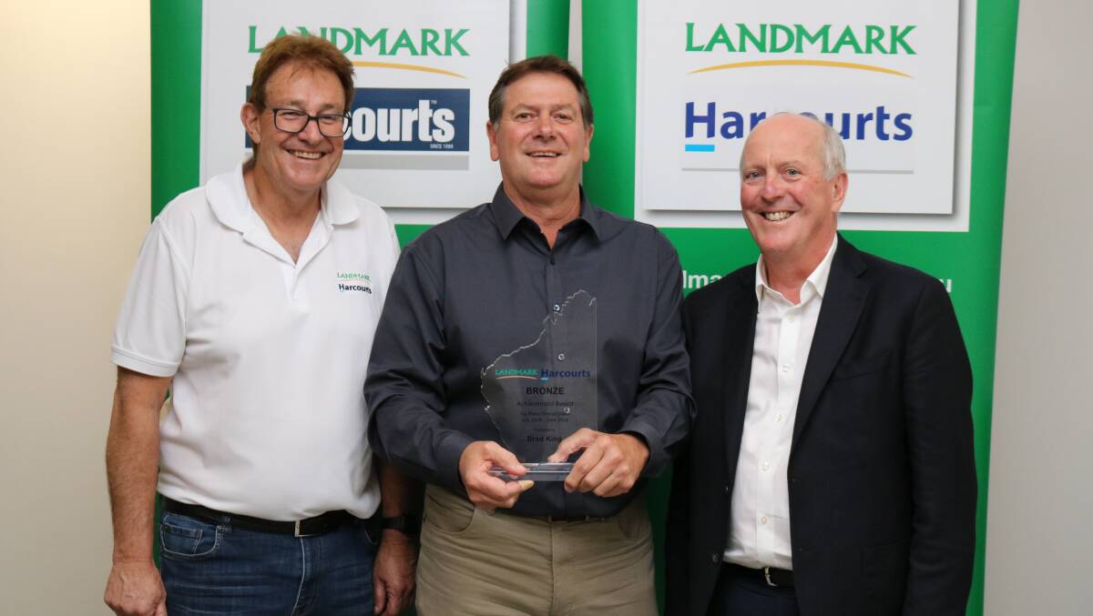 Geraldton sales representative Brad King (centre) won the Landmark Harcourts bronze achievement award for third place in overall sales for 2018-19 presented by Landmark Harcourts real estate manager for west region, Glenn McTaggart, (left) and sponsor, WA Property Lawyers principal Brian McCormack.