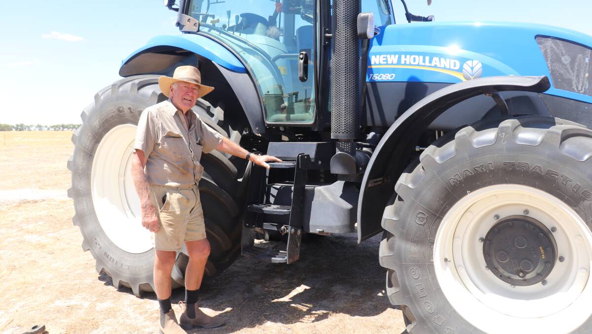 Neighbour Graham Penny, York, checking out the 2018 New Holland T6080 tractor that was passed in.