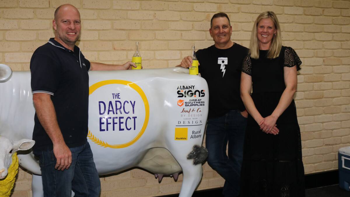 Craig Dayman (left), Albany Signs, and Todd Jefferis, Breaksea Electrical with the charity cow Mr Dayman painted for Kate Mitchell, Narrikup, founder of The Darcy Effect.