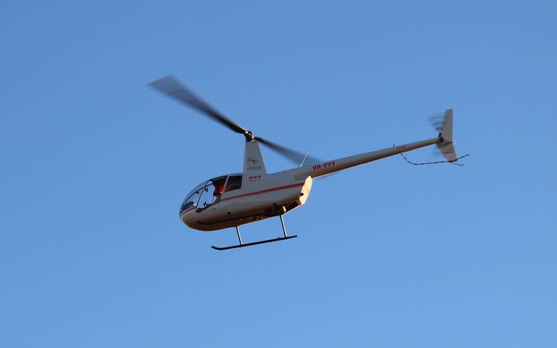 One of Fortescue Helicopters craft heading out for a day of mustering.
