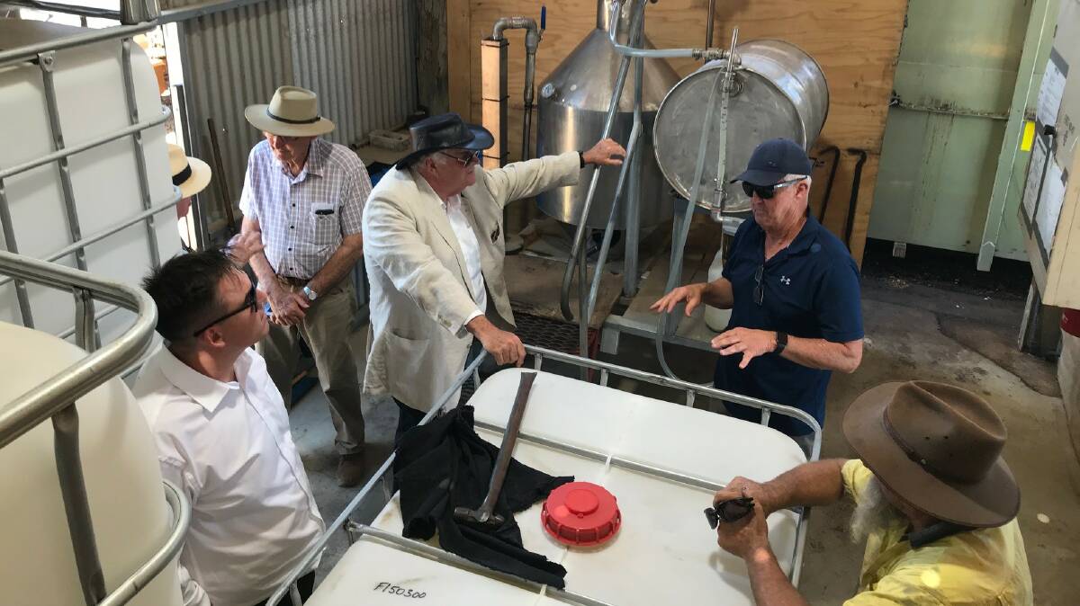 Western Australia Governor Kim Beazley (black hat) also visited Kochii Eucalyptus Oil earlier this year. Kochii director and local farmer Ian Stanley (blue cap) and Kochii operations manager Richard Leitch (brown hat) explain the distillation process to Mr Beazley and an aide. In the background is Kalannie farming neighbour Robert Nixon.