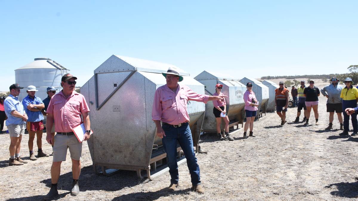  Auctioneer Graeme Curry offering one of the four 2019 Universal Lick Feeders (4200L) which sold between $1800 and $2300.