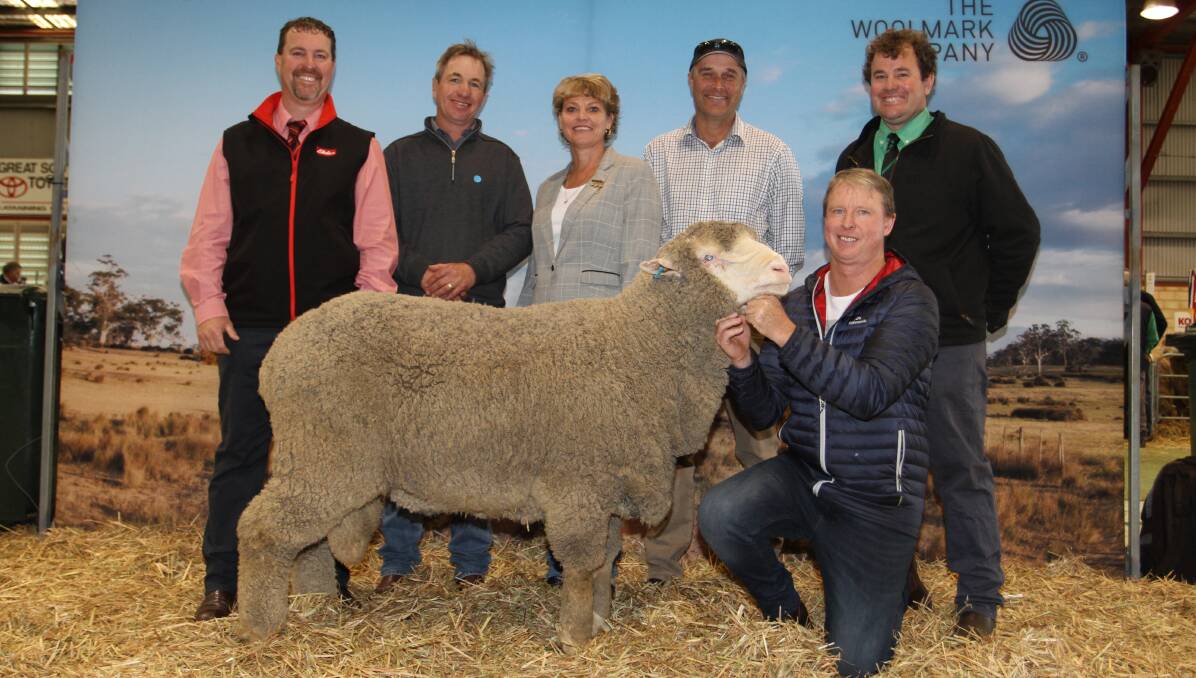  The Gooding family's East Mundalla stud, Tarin Rock, topped this year's Katanning Stud Merino Ram Sale when it sold a March shorn Poll Merino ram for $33,000 to the Belka Valley stud, Bruce Rock, with semen shares to the Eastville Park stud, Wickepin and Greenfields stud, Hallett, South Australia. With the top-priced ram were Nathan King (left), Elders stud stock, buyers Grantly Mullan, Eastville Park stud and Robyn and Phil Jones, Belka Valley stud, East Mundalla stud co-principal Daniel Gooding and Mitchell Crosby, Nutrien Livestock Breeding, who was also the losing bidder on the ram.