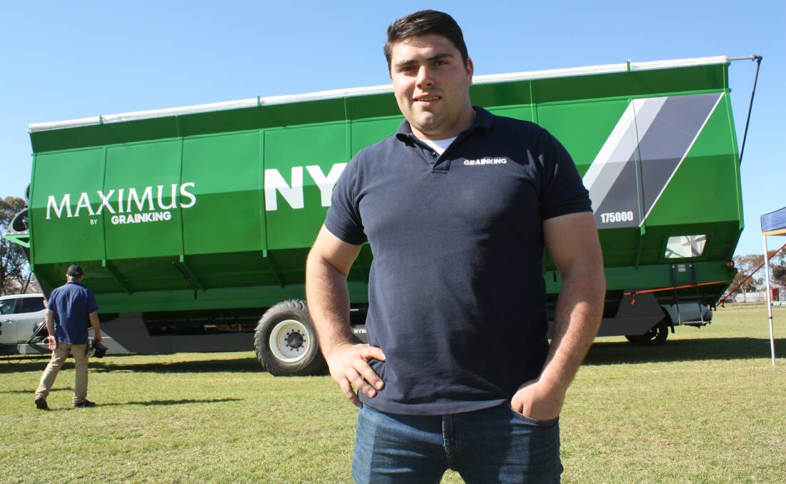  Grain King director Martin Trewarn with the company's flagship field bin, the Maximus, with a 140 tonne capacity. A new model boasts a capacity of 220t, making it one of the largest of its kind in the industry.