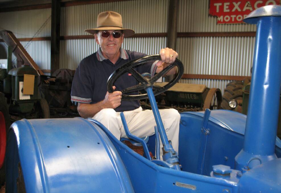 Ken back at the wheel of the Lanz Bulldog he used to drive on the family farm at Cunderdin. He unexpectedly discovered the restored tractor at the Dardanup Heritage Park during an interview about the famous museum.