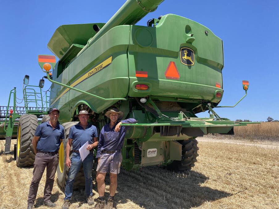 Johnny Inferrera (left), McIntosh Distribution and David Thorne, McIntosh & Son, Wongan Hills, caught up with York grower Andrew Boultbee last harvest, who updated the operation and performance of one of the family's vertical, mechanical Harrington Seed Destructors, installed on their John Deere S680 headers.
