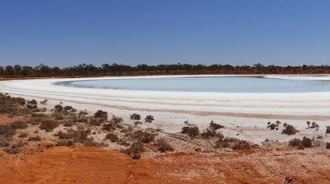 Australian Potash Ltd has tested seepage barriers for its Lake Wells Sulphate of Potash fertiliser project by creating a trial solar evaporation concentrator pond through constructing a causeway across a salt lake inlet and pumping hypersaline brine in behind it.