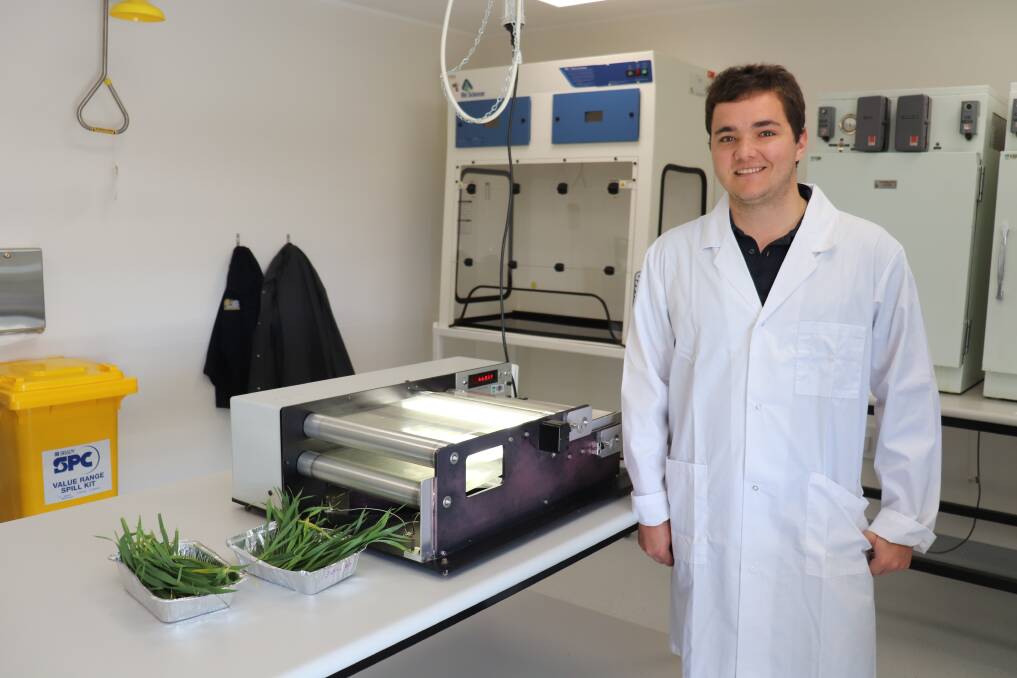 DPIRD technical assistant Mitchell Crabb measuring the surface area of weeds in one of the Merredin facility's upgraded laboratories.