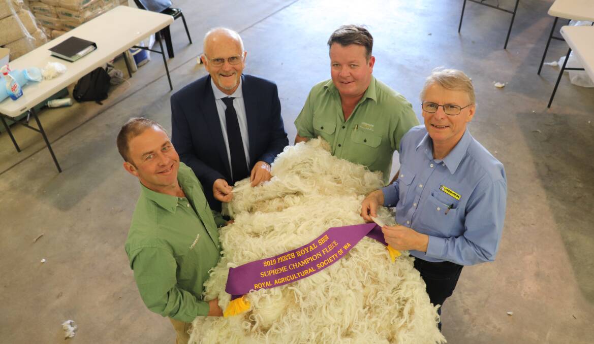 Wool competition judges Matthew Chambers (left), Landmark, chief judge Tim Chapman, Primaries of WA, Cameron Henry, Landmark and Carl Poingdestre, Dyson Jones Wool Marketing Services, with the Supreme fleece of the 2019 Perth Royal Show. The King family, Rangeview Merino and Poll Merino stud, Darkan, won the Supreme fleece award for a second year in a row.